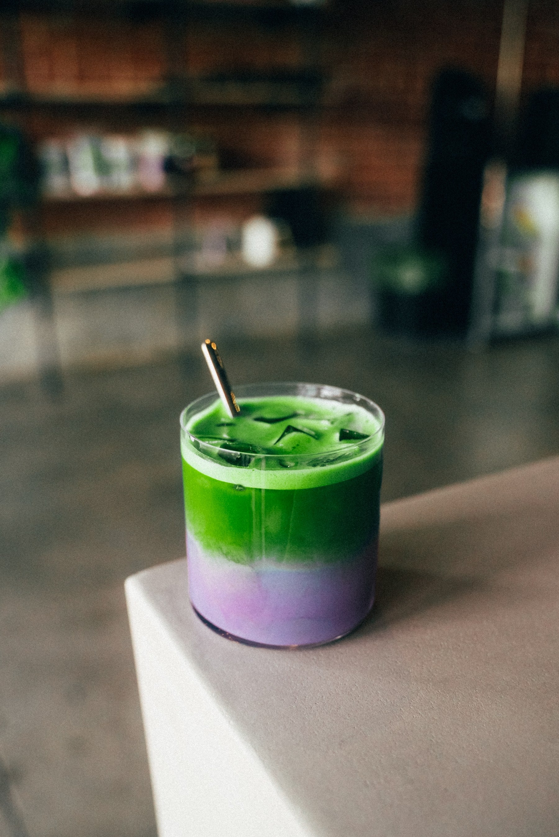 Iced blueberry matcha, green over lavender